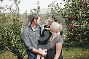 A Caucasian family is spending time at the farm together