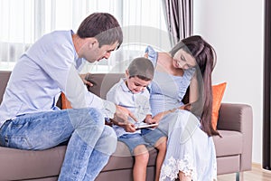 Caucasian family in status of serious. Father and mother looking