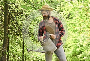 Caucasian farmer countryside nature background. Garden tools every gardener should have. Look after them and store them