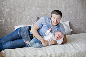 Caucasian Father and Daughter Lying on Bed