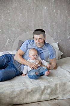 Caucasian Father and Daughter Lying on Bed