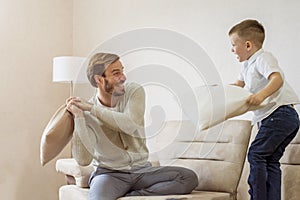 Caucasian father playing with his chid at home