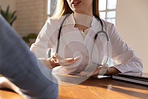 Caucasian female doctor consult patient at meeting