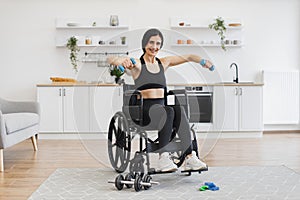Caucasian female with mobility impairment doing seated exercises with weights.