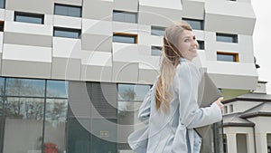 Caucasian female office worker rushing on her business with folders. Pretty woman business worker. Job, activity