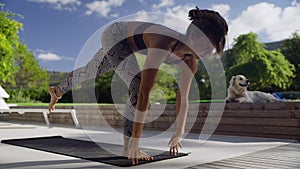 Caucasian female stretching outdoors feeling energised exercising in the summer sun