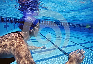 Caucasian female swimmers swimming in pool