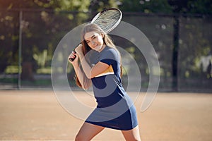 Caucasian female tennis player playing on the court outdoors