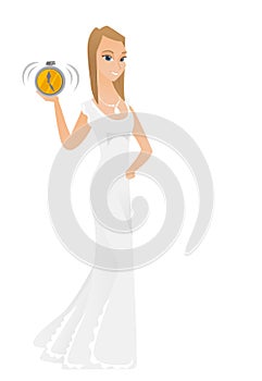 Caucasian fiancee holding alarm clock.