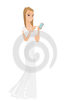 Caucasian fiancee holding a mobile phone.