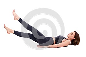 Caucasian fit woman doing flutter kicks exercise isolated on white