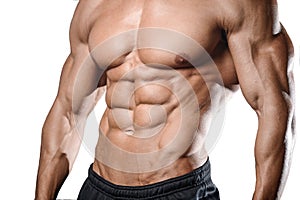 Caucasian fitness model in gym close up abs