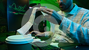 Caucasian focused man programmer checking coding guy coder male professional digital engineer IT support drinking coffee