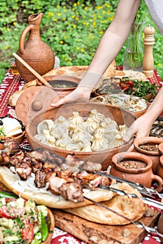 Caucasian food Georgian shashlik khinkali salad Dinner table