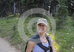 Caucasian forty-five yearold mother enjoying a hike in Mount Rainier National Park, Washington photo