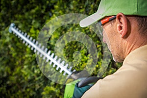 Caucasian Gardener with Hedge Trimmers photo