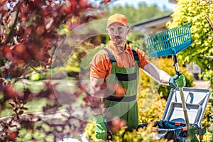 Caucasian Gardener with Rake