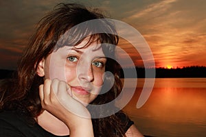 Caucasian girl 13 years old, closeup on sunset background