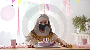 Caucasian girl disappointing on her birthday. Festive colorful background with balloons. Birthday party and wishes