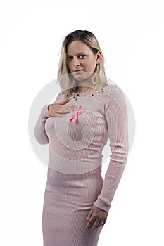 Caucasian girl holding breast cancer ribbon