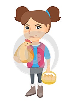 Caucasian girl holding a chicken and hen eggs.