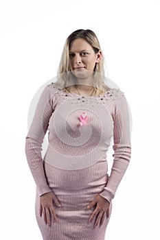 Caucasian girl with a pink dress with a breast cancer ribbon