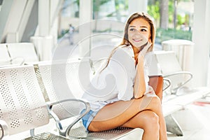 Caucasian girl in a waiting hall