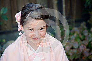 Caucasian girl wearing a traditional Japanese kimono