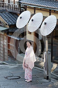 Caucasian girl wearing a traditional Japanese kimono