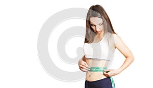 Caucasian girl.Weight loss, slim body, diet, sport, fitness and health concept. young beautiful woman measures her ideal figure,