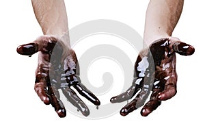 Caucasian hands cupped with black heavy fuel