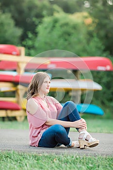 Caucasian High School Senior Girl Outside Sitting