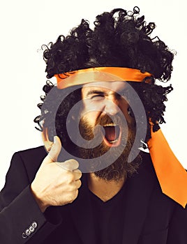 Caucasian hipster in suit and black curly tie-tied afro wig