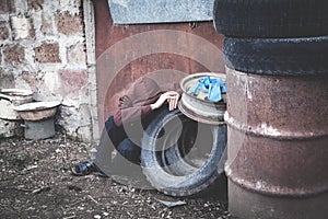 Caucasian homeless man sitting and thinking.