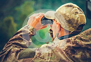 Spotting Game Using Binoculars photo