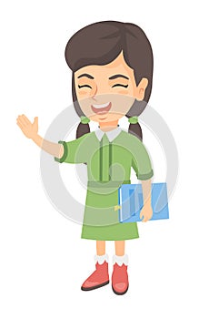 Caucasian laughing girl holding a book.