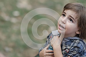 Caucasian little boy in a summer hat outdoors