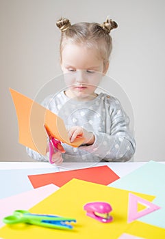 Caucasian Little Girl Cutting with Scissor Colorful Paper