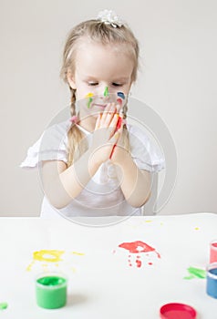 Caucasian Little Girl Painting with Colorful Hands Paints at Home Early Education