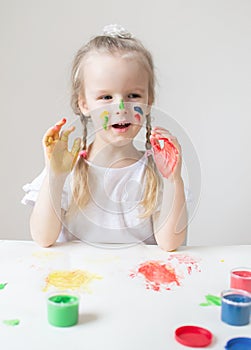 Caucasian Little Girl Painting with Colorful Hands Paints at Home Early Education