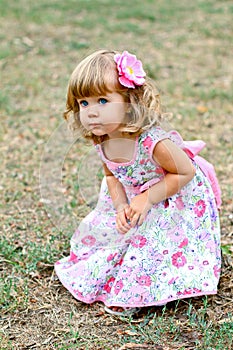 Caucasian little girl walking in the park