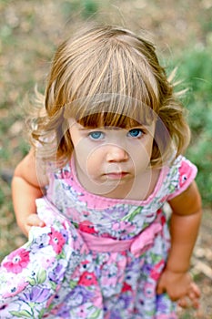 Caucasian little girl walking in the park