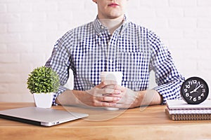 Caucasian male with coffee cup