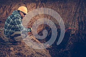 Caucasian Male Construction Geologist Surveys Natural Resources On Job Site