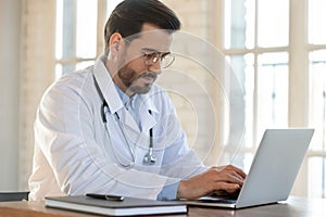 Caucasian male doctor consult client on laptop online