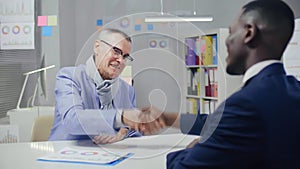 Caucasian male retired person shaking hands