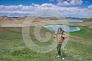 Caucasian man with backpacks View from p Pamir