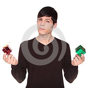 Caucasian man comparing green present to red