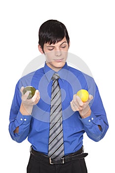 Caucasian man comparing lime to lemon