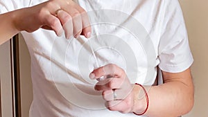 Caucasian man doing an antigentest for coronavirus. The collected smear from the nasopharynx is dipped into the reagent